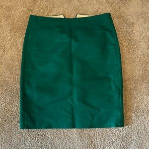 J. Crew brand, fancy green mini/pencil skirt (fake pockets).